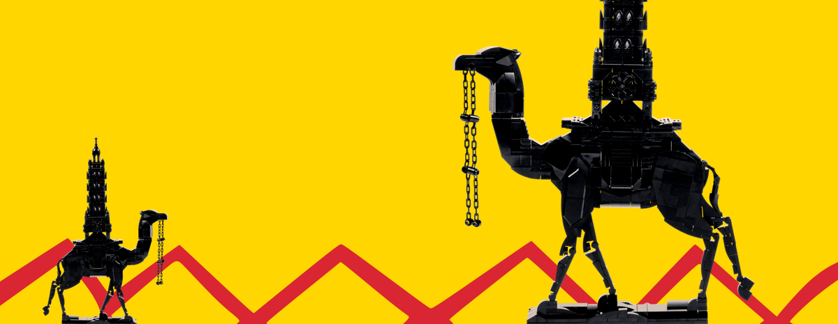 Black camel sculpture on a bright yellow backdrop with red motif